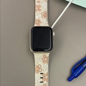 Silver Apple Watch with Beige Floral Silicone Band - Compatible Wearable
